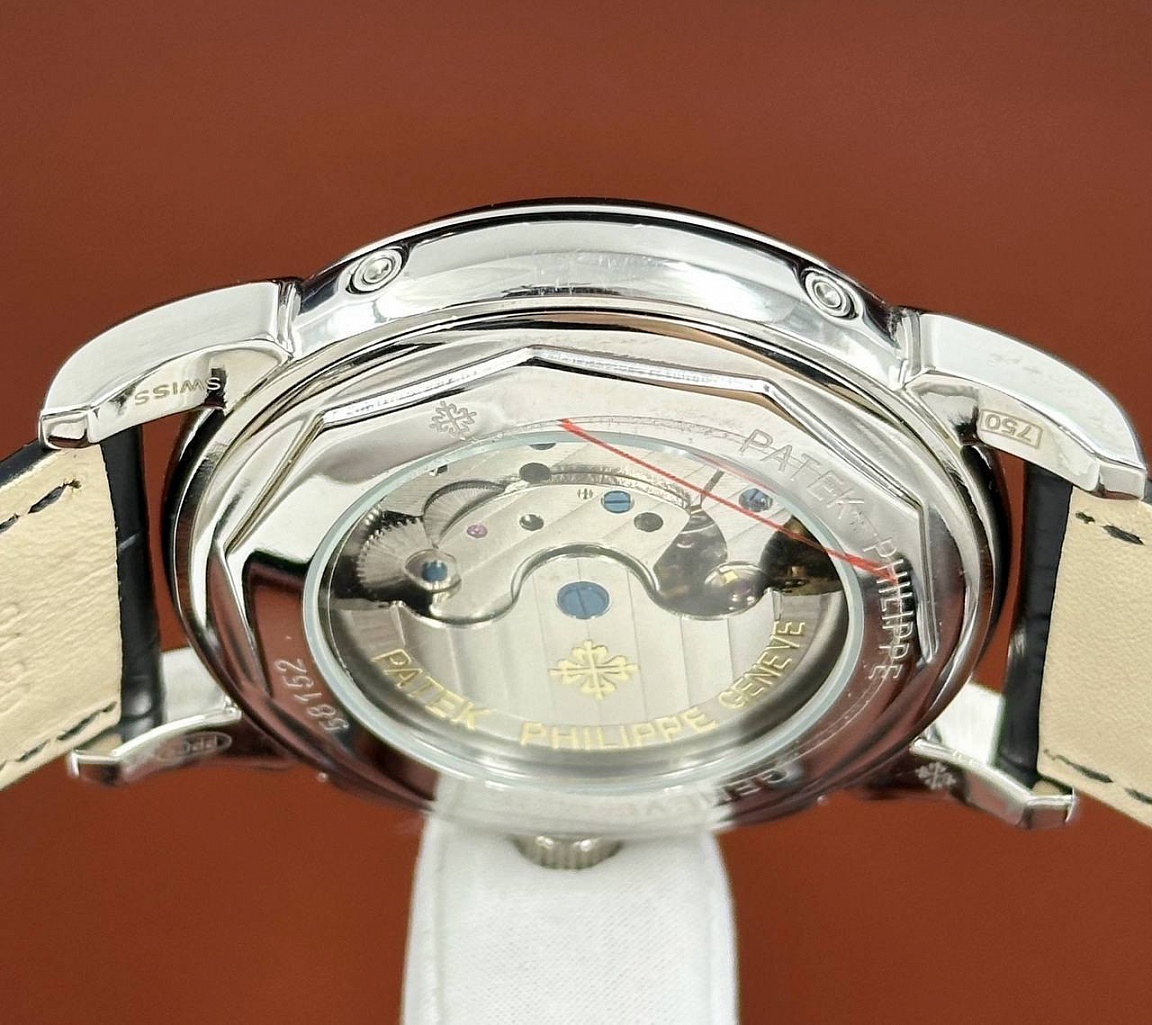 Patek Philippe Grand Complications 45 мм: золотистый солнечный мотив на чёрном циферблате и фактурный ремешок